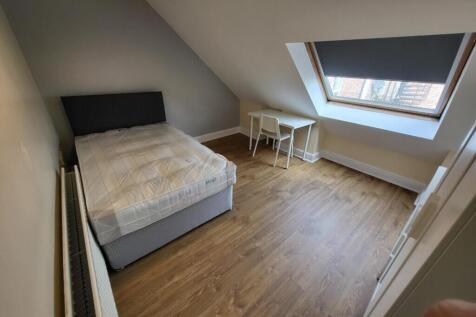 Bright and spacious double bedroom featuring a ...