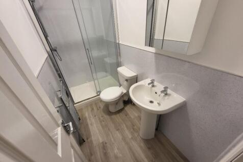 A modern and stylish bathroom featuring a sleek...