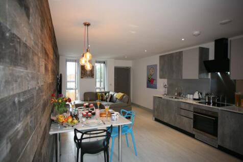 A stylish contemporary living room with a sleek...