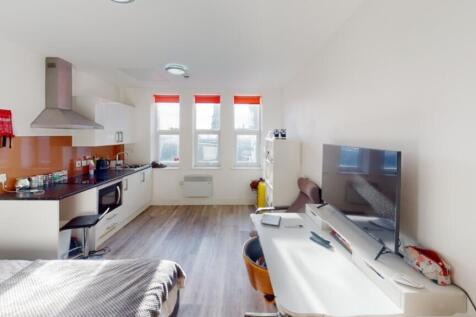 Bright and spacious double bedroom featuring a ...