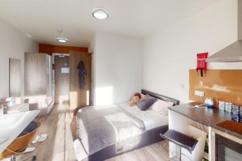 A bright and inviting double bedroom featuring ...