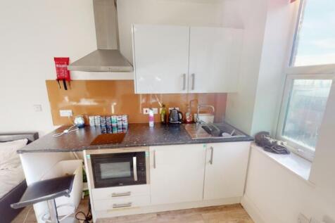 This modern kitchen features a sleek design wit...