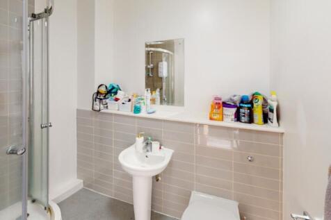 A well-maintained bathroom featuring modern fix...