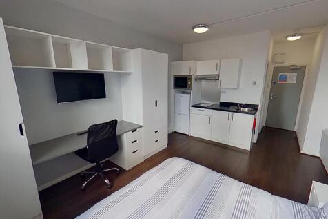 This stylish double bedroom features a modern d...