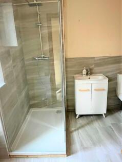 Bright and modern bathroom featuring a spacious...