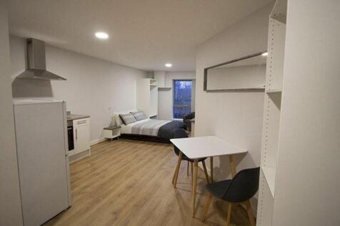 This modern double bedroom features a cozy layo...