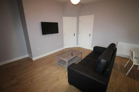 A cozy and inviting living room featuring a mod...