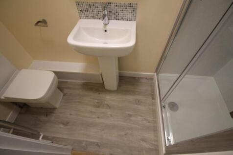 A well-maintained bathroom featuring a modern s...