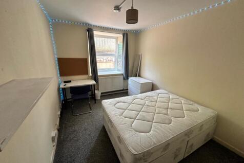 A bright and spacious double bedroom featuring ...