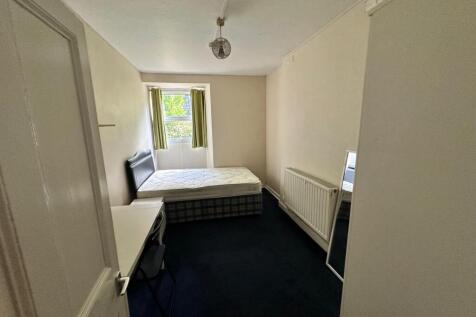 A well-lit and spacious double bedroom, perfect...