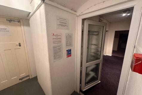 Bright communal hallway with a glazed internal ...
