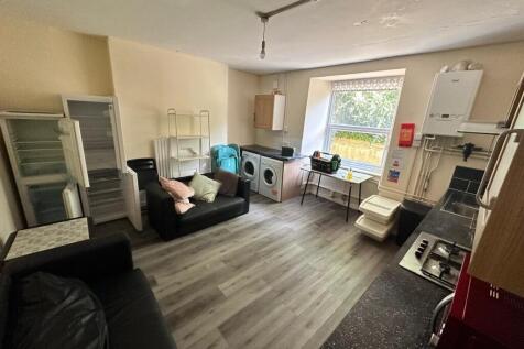 A spacious and well-lit kitchenette with modern...