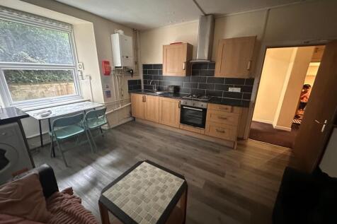 Bright, modern kitchen with fitted wooden cabin...