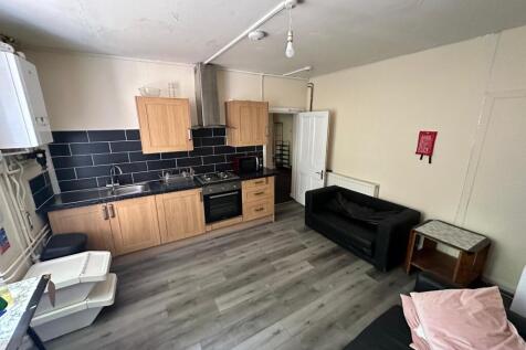 A functional and tidy kitchenette with modern a...
