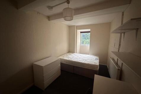 Well-presented bedroom with a double bed, chest...