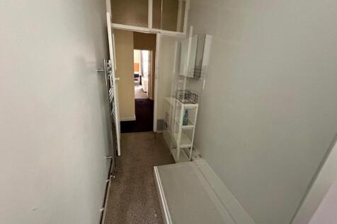 A tidy and well-maintained hallway that provide...