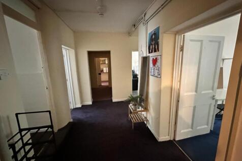 A well-maintained and spacious hallway that con...