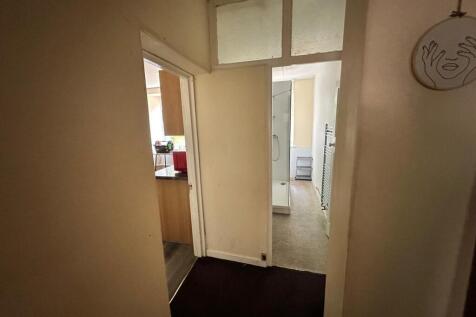A functional hallway leading to various areas o...