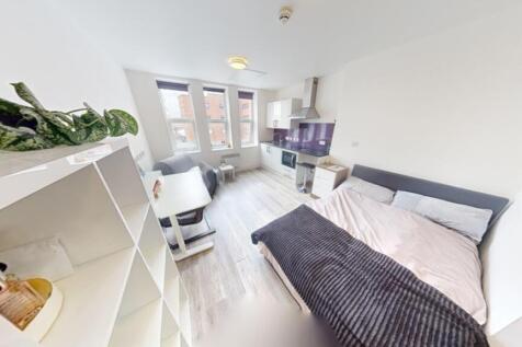 A bright and spacious double bedroom featuring ...