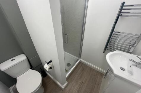 This modern bathroom features a sleek design wi...