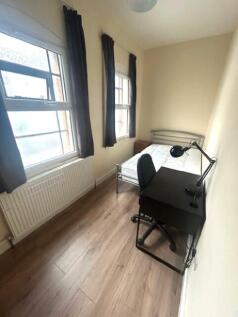 A neat and bright single bedroom featuring two ...