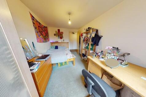 A neat and functional single toilet room with c...