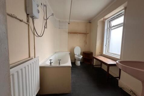 Spacious bathroom with a full-size bathtub, sep...