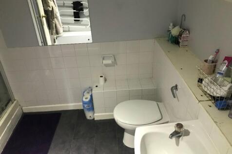 A well-maintained bathroom featuring a modern d...