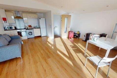 A bright and spacious living area featuring amp...