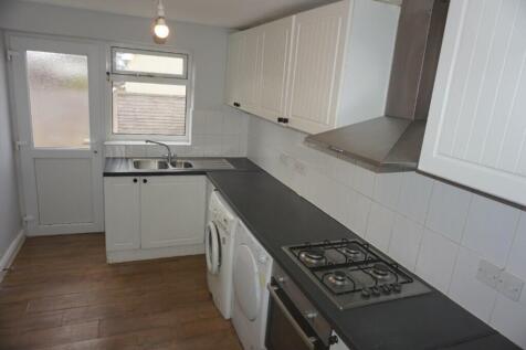 A bright and tidy kitchenette with modern appli...