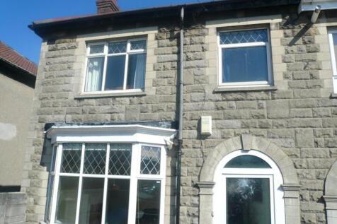A charming exterior view of the property featur...
