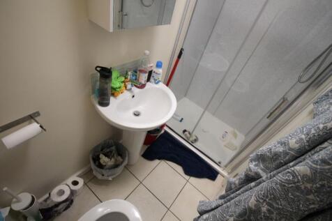 This practical bathroom features a convenient s...