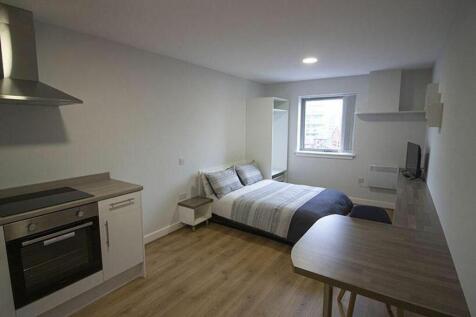 This stylish double bedroom features ample natu...