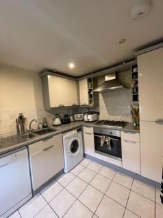 This modern kitchen features a stylish design w...