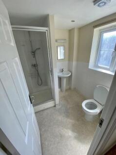 Modern bathroom suite featuring a spacious show...