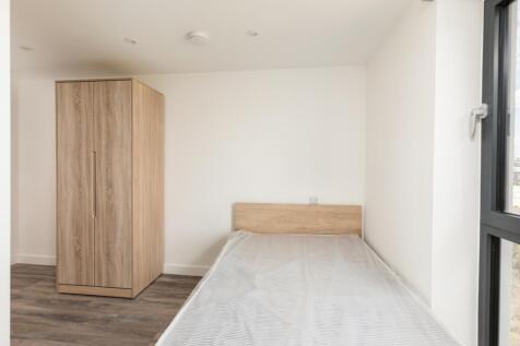 A bright and spacious double bedroom featuring ...
