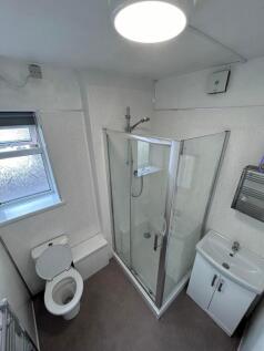 A modern and clean bathroom featuring a spaciou...