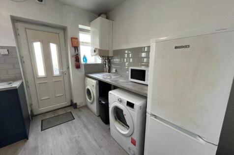 A functional kitchenette with essential applian...