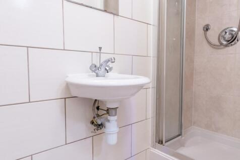 A well-maintained bathroom featuring a clean si...