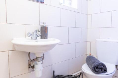 A well-maintained single toilet featuring a cle...
