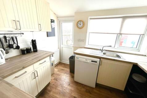 Bright and inviting kitchen featuring modern ap...
