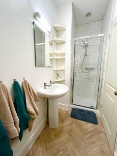 This beautifully designed bathroom features a m...