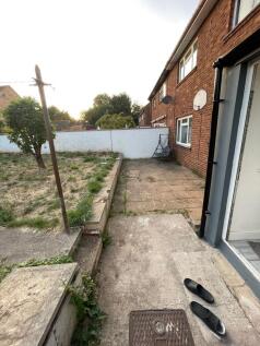 A charming terraced house exterior featuring a ...