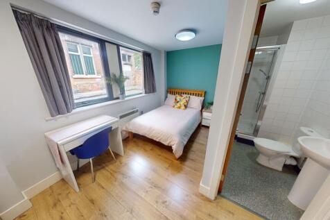 Bright and tidy double bedroom featuring a comf...