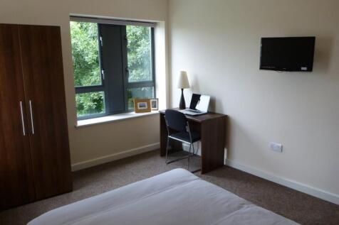 A bright and inviting double bedroom featuring ...