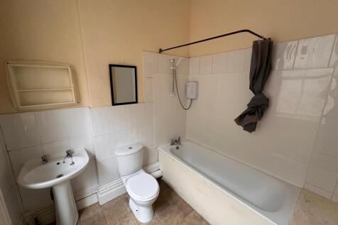 Simple, functional bathroom with a full-size ba...