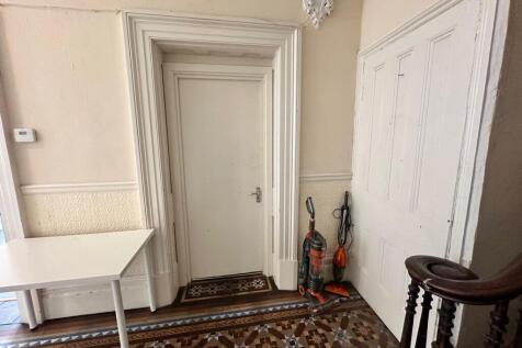 A well-maintained hallway featuring decorative ...