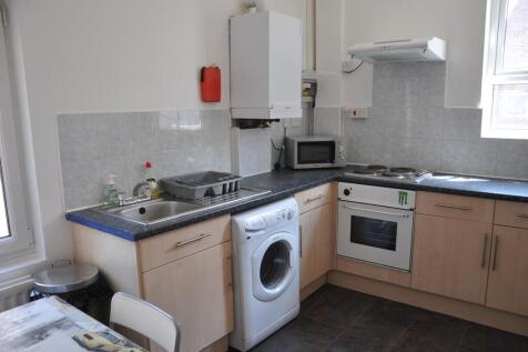 A modern kitchenette with ample space and natur...