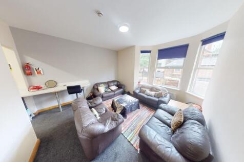 Bright and comfortable living room featuring la...