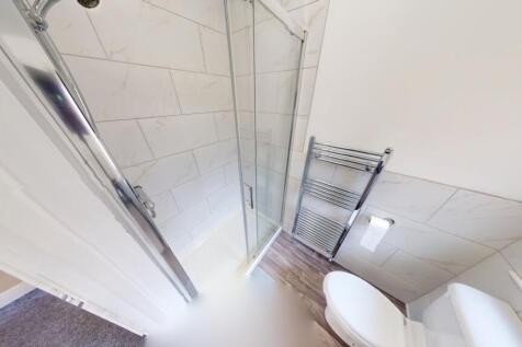 Bright and clean bathroom featuring modern fitt...